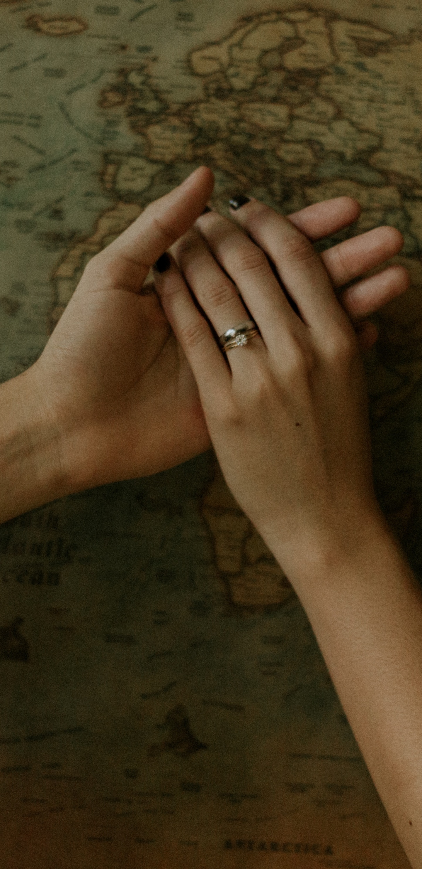 Persons Left Hand on Brown Wooden Surface. Wallpaper in 1440x2960 Resolution