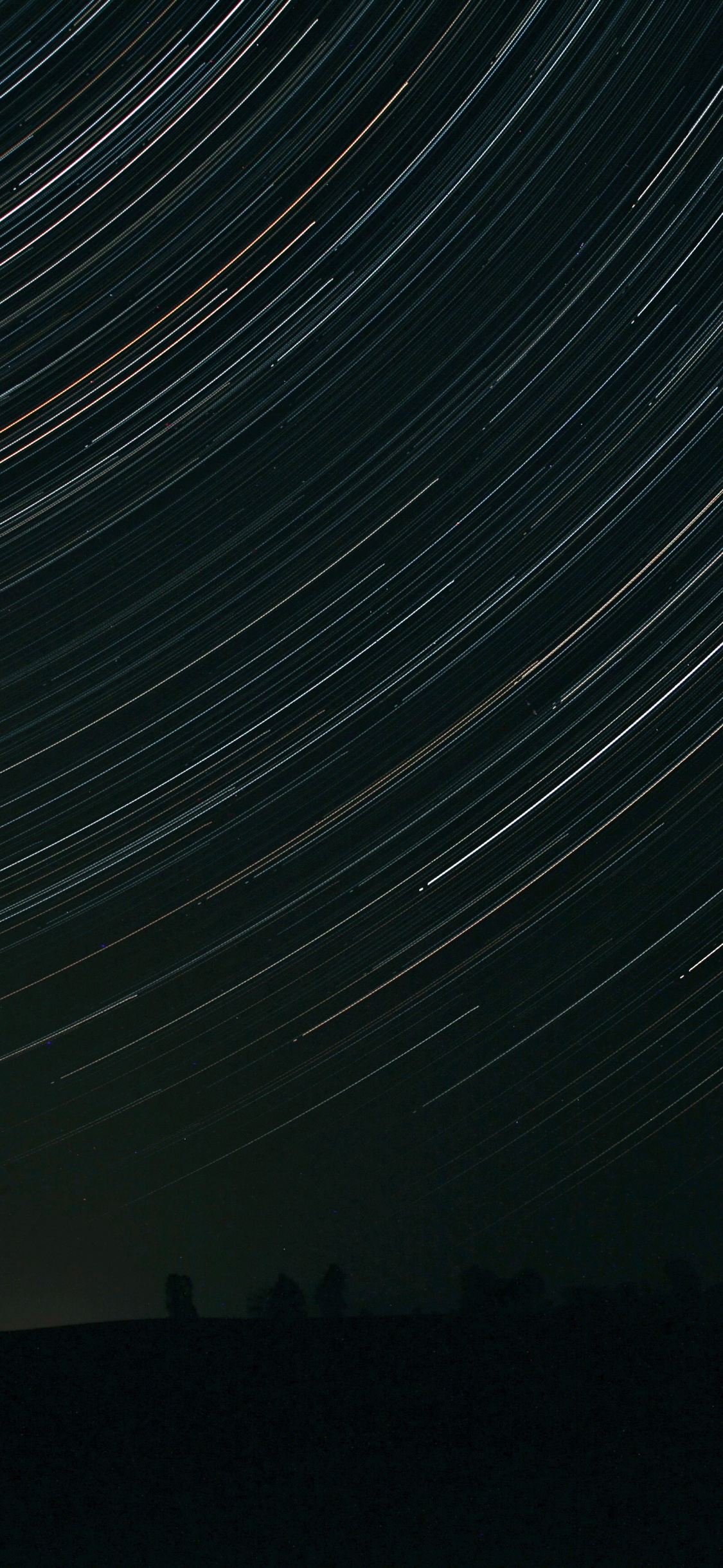 Time Lapse Photography of Stars During Night Time. Wallpaper in 1125x2436 Resolution