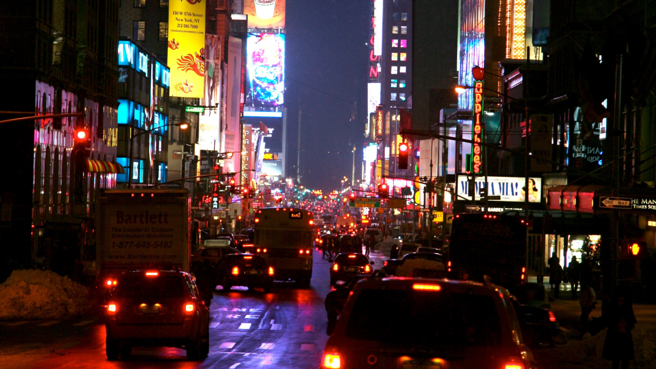 Cars on Road Between High Rise Buildings During Nighttime. Wallpaper in 1280x720 Resolution