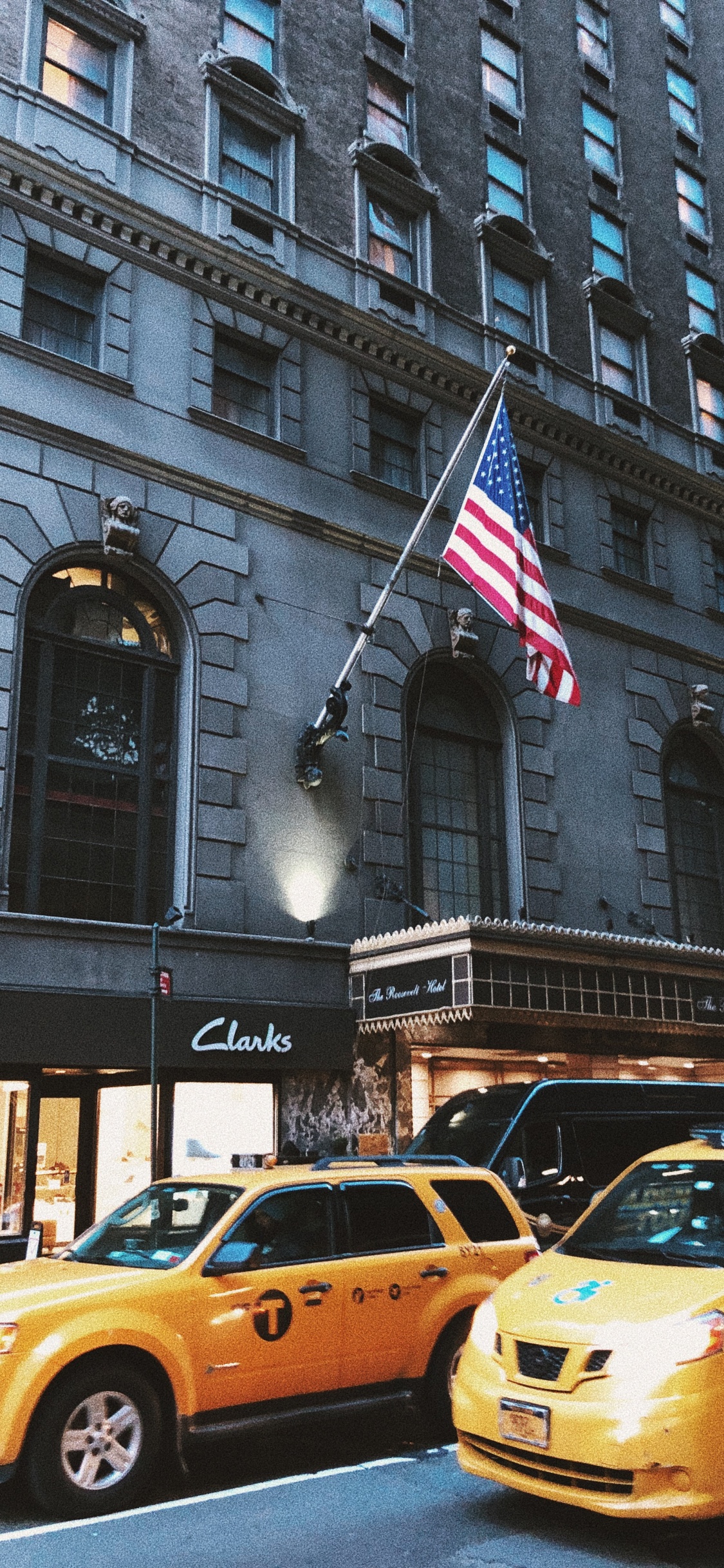 Yellow Taxi Cab on Road Near Building During Daytime. Wallpaper in 1125x2436 Resolution