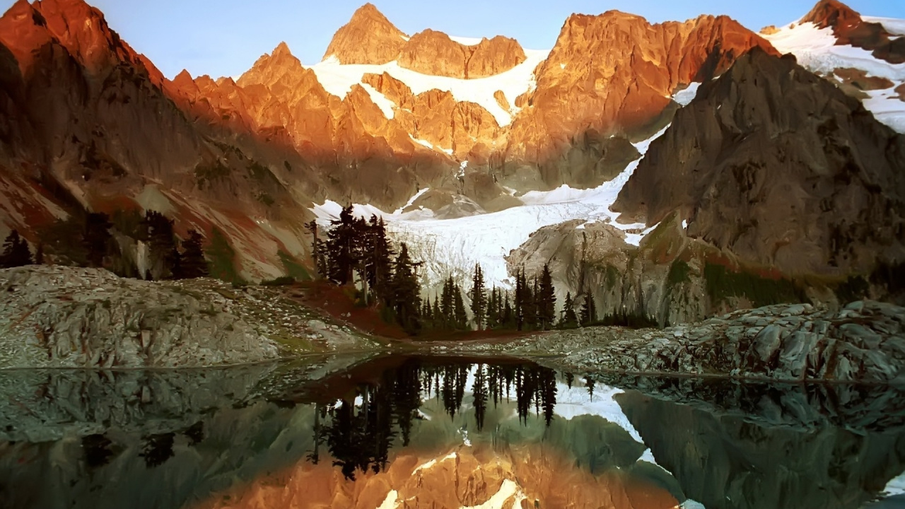 Brown and White Mountains Near Green Trees and Lake During Daytime. Wallpaper in 1280x720 Resolution