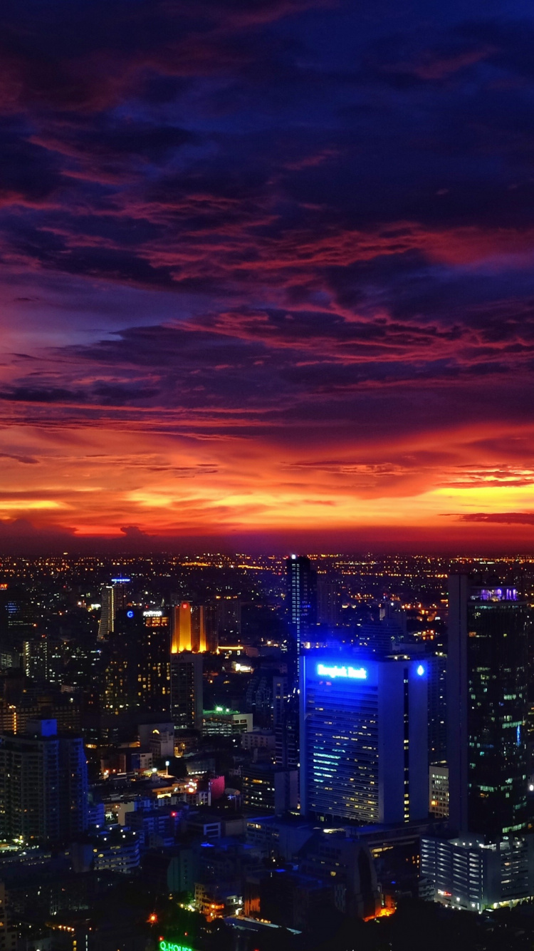 City With High Rise Buildings During Night Time. Wallpaper in 750x1334 Resolution