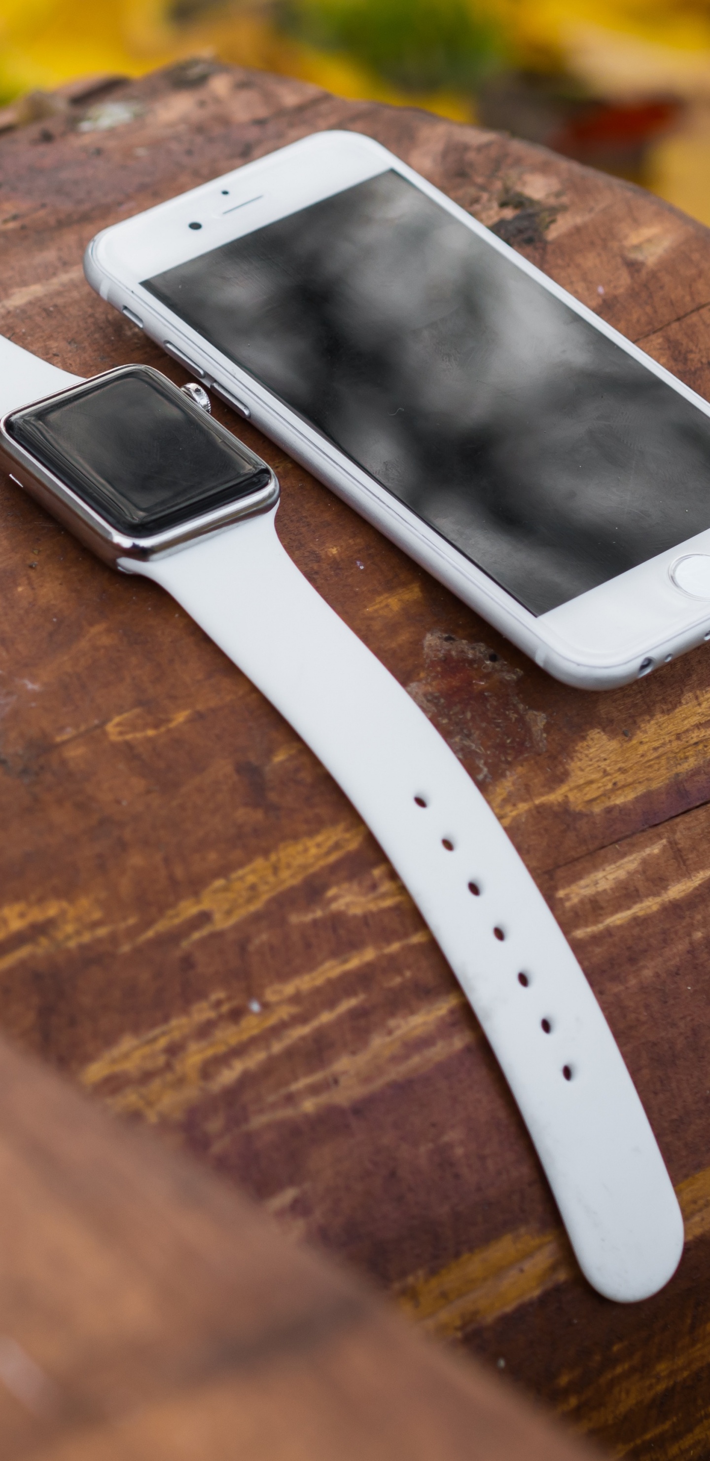 White Iphone 5 on Brown Wooden Table. Wallpaper in 1440x2960 Resolution