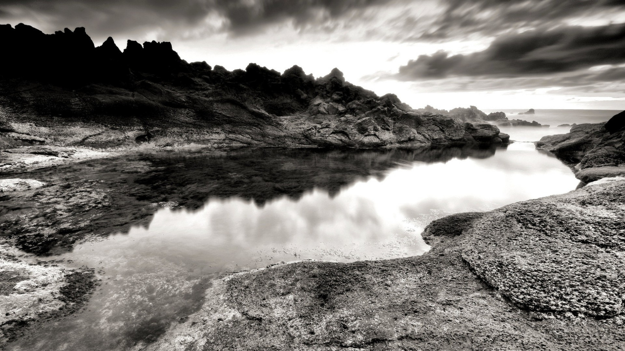 Grayscale Photo of Lake Near Mountain. Wallpaper in 1280x720 Resolution