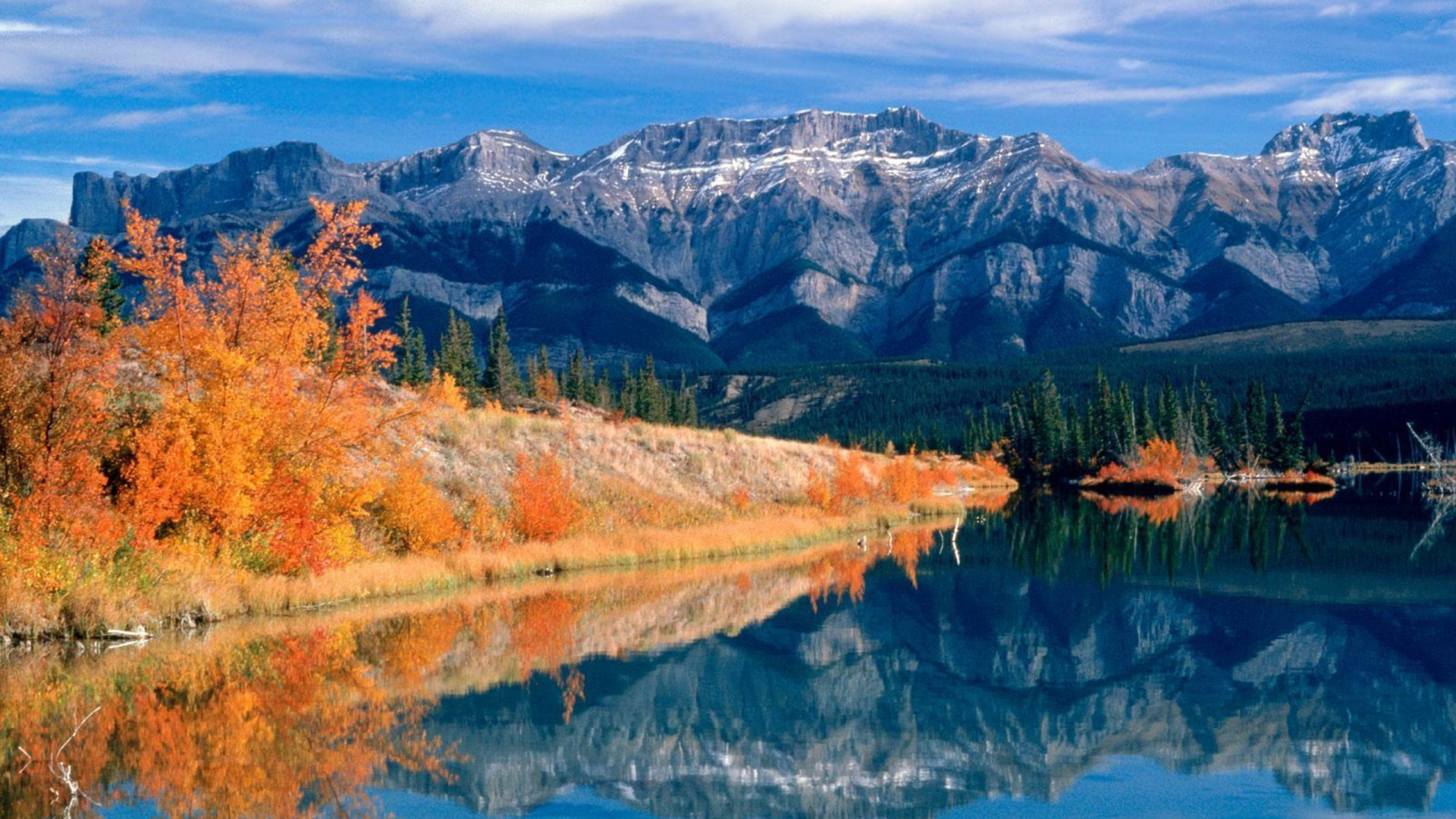 Green and Brown Trees Near Lake and Mountain Under Blue Sky During Daytime. Wallpaper in 1920x1080 Resolution