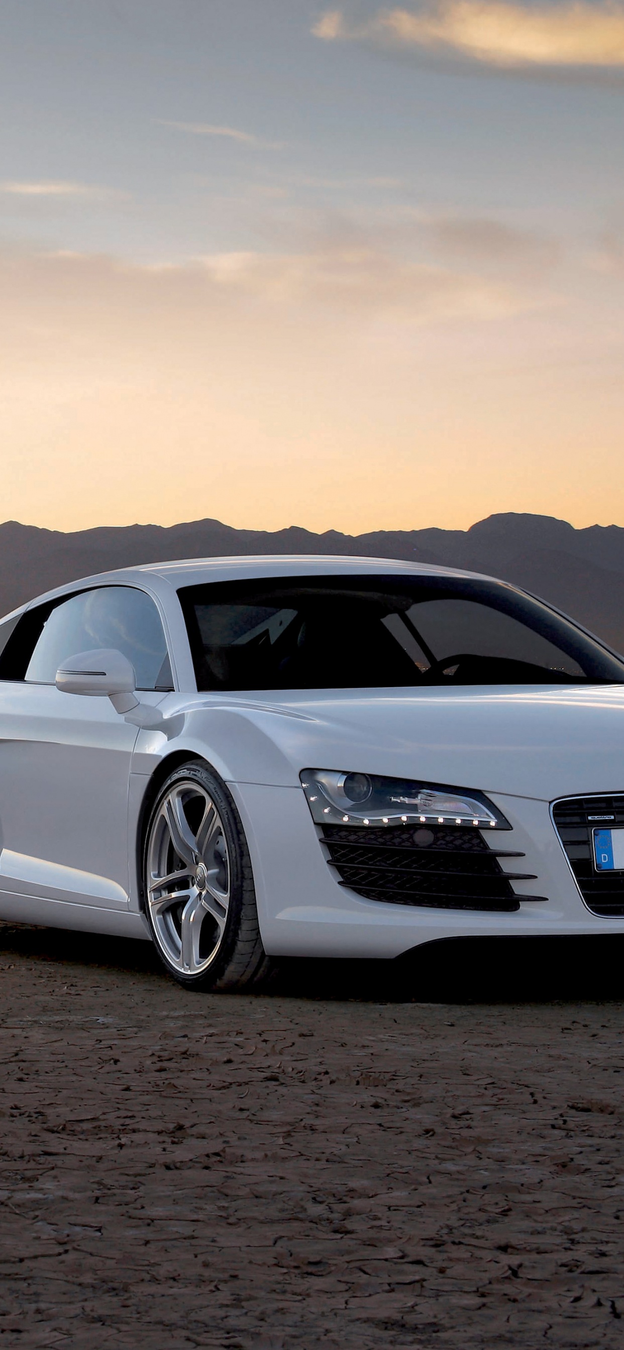 Coupé Bmw m 3 Blanc Sur le Sable Brun Pendant le Coucher du Soleil. Wallpaper in 1242x2688 Resolution