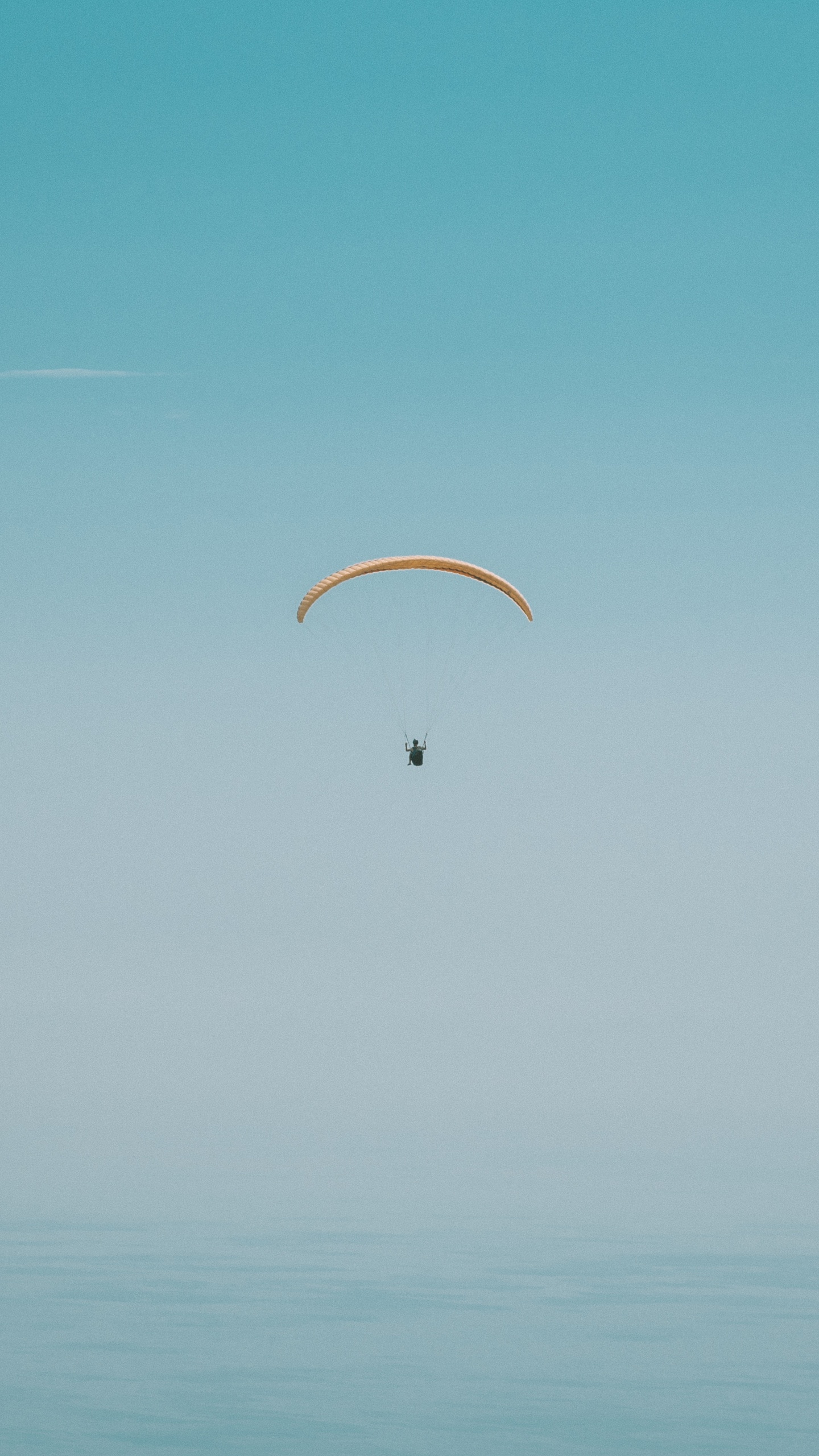 Person in Parachute Under Blue Sky During Daytime. Wallpaper in 1440x2560 Resolution