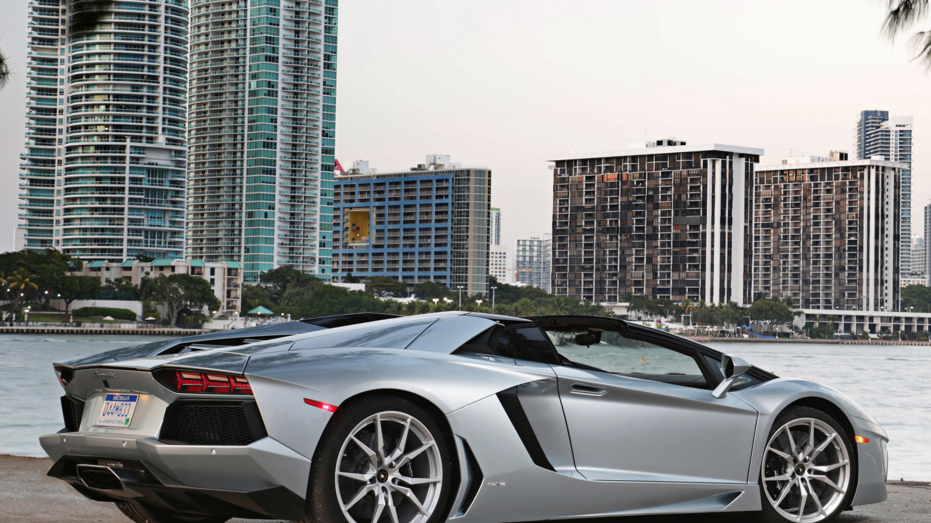 Black Lamborghini Aventador Parked on Gray Pavement. Wallpaper in 1920x1080 Resolution