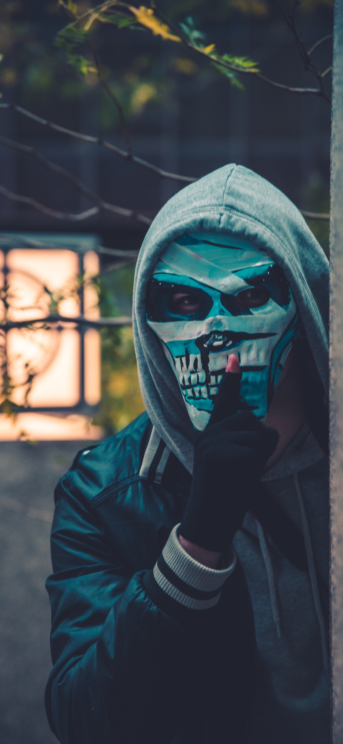 Person in Black Leather Jacket Wearing Mask. Wallpaper in 1125x2436 Resolution