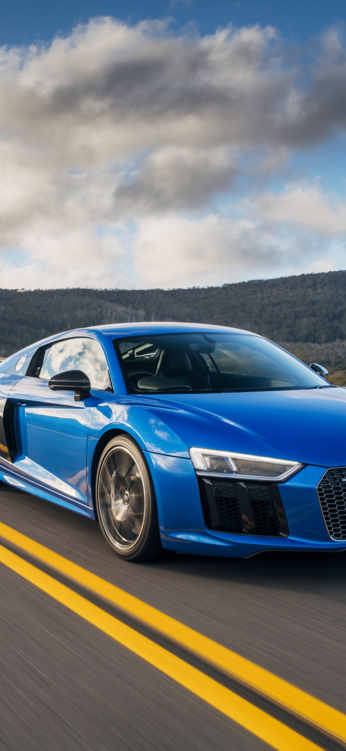 Blue Audi Coupe on Road During Daytime. Wallpaper in 1125x2436 Resolution