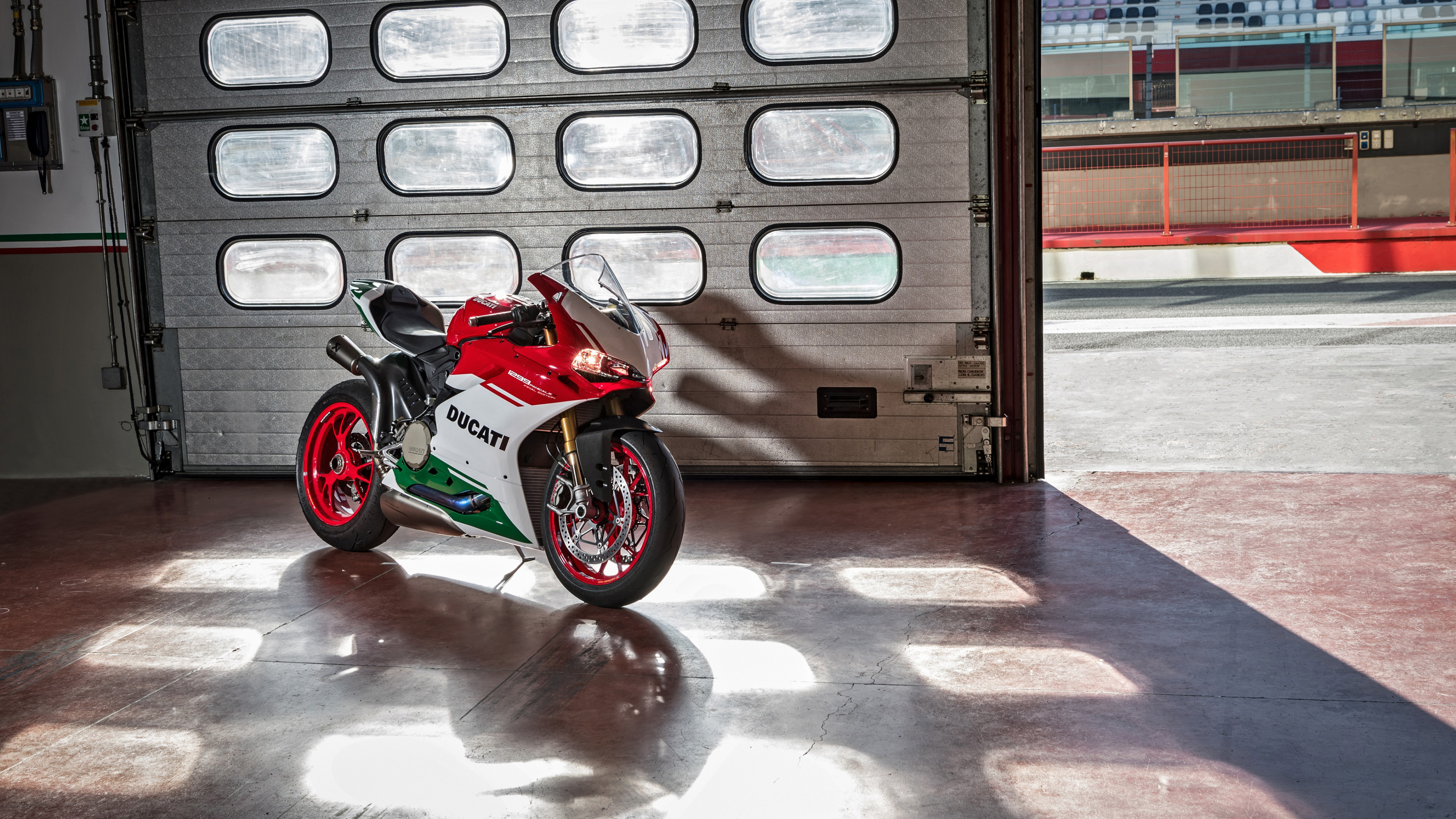 Red and Black Sports Bike Parked Beside White and Brown Concrete Building During Daytime. Wallpaper in 3840x2160 Resolution