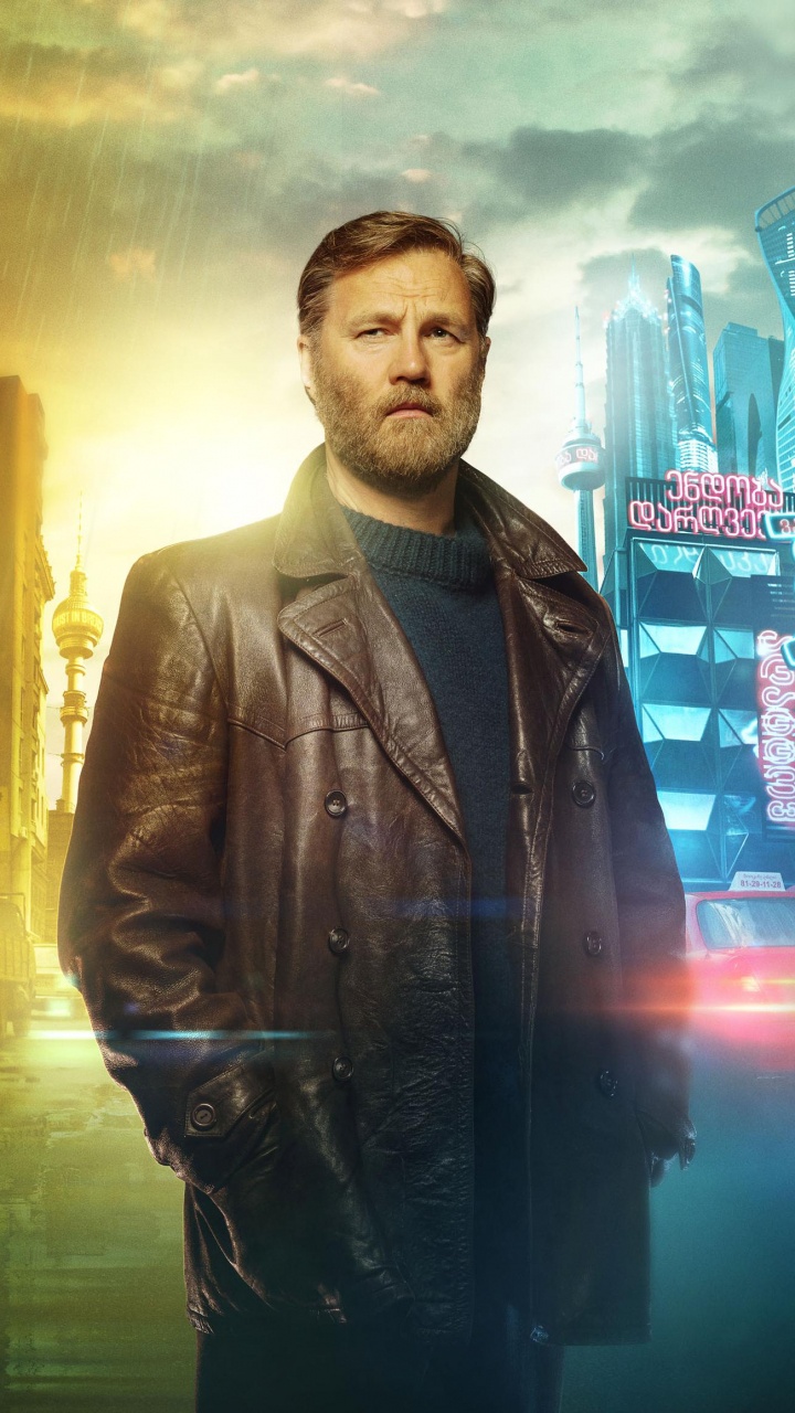 L'homme en Blouson de Cuir Noir Debout Sur le Trottoir Pendant la Nuit. Wallpaper in 720x1280 Resolution