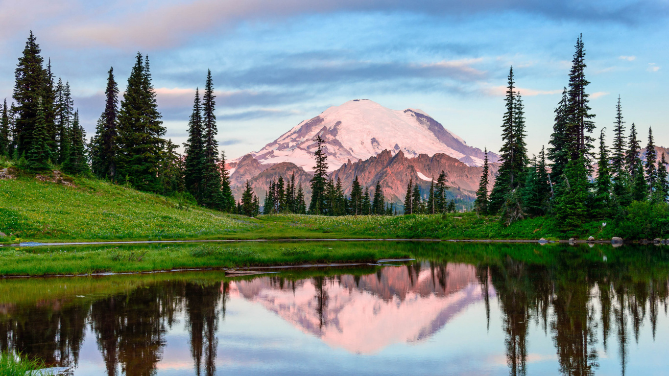 Green Grass Field Near Lake and Mountain During Daytime. Wallpaper in 1366x768 Resolution