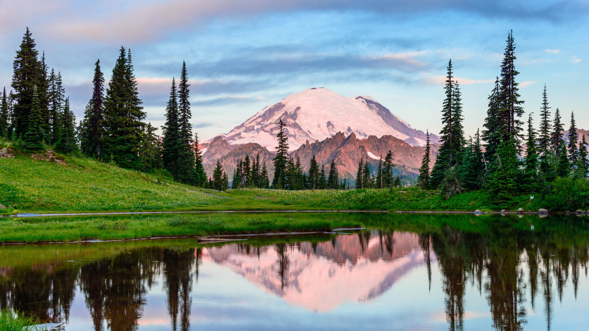 Green Grass Field Near Lake and Mountain During Daytime. Wallpaper in 1920x1080 Resolution