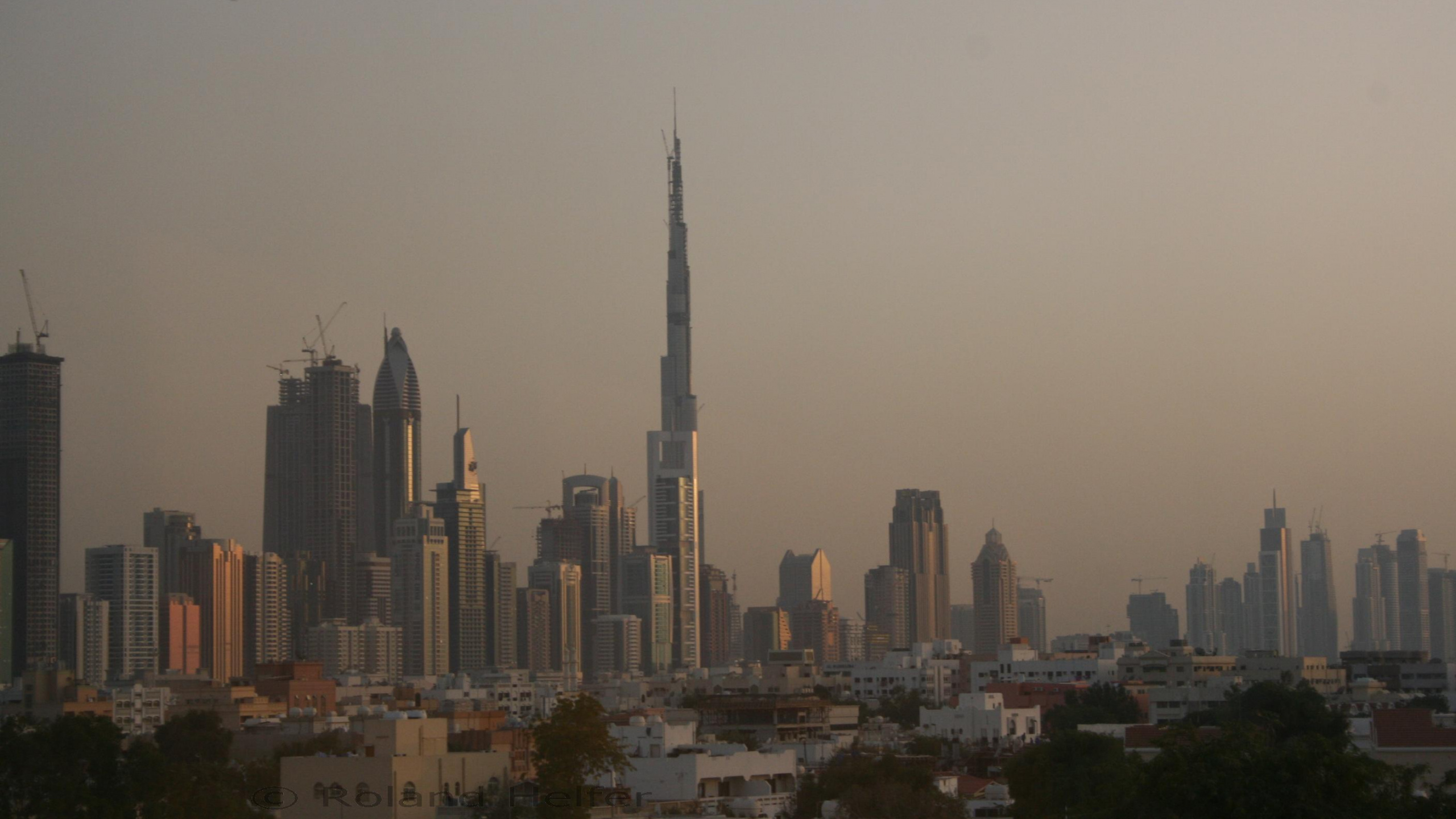 City Skyline Under Gray Sky During Daytime. Wallpaper in 2560x1440 Resolution