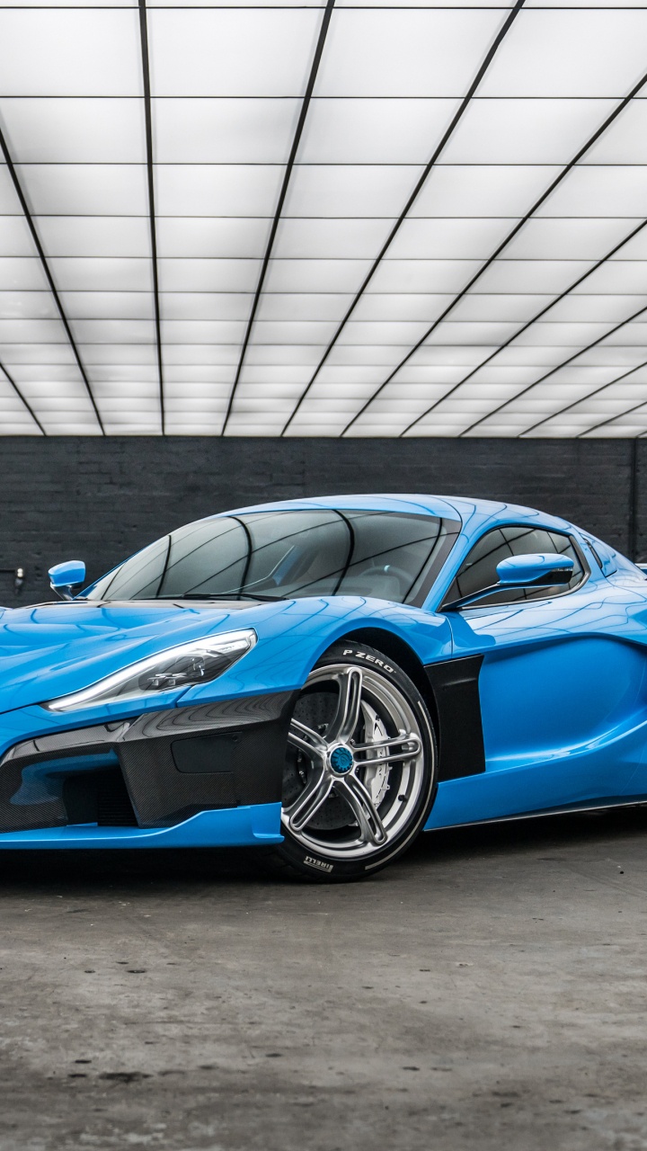 Blue Chevrolet Camaro in a Parking Lot. Wallpaper in 720x1280 Resolution