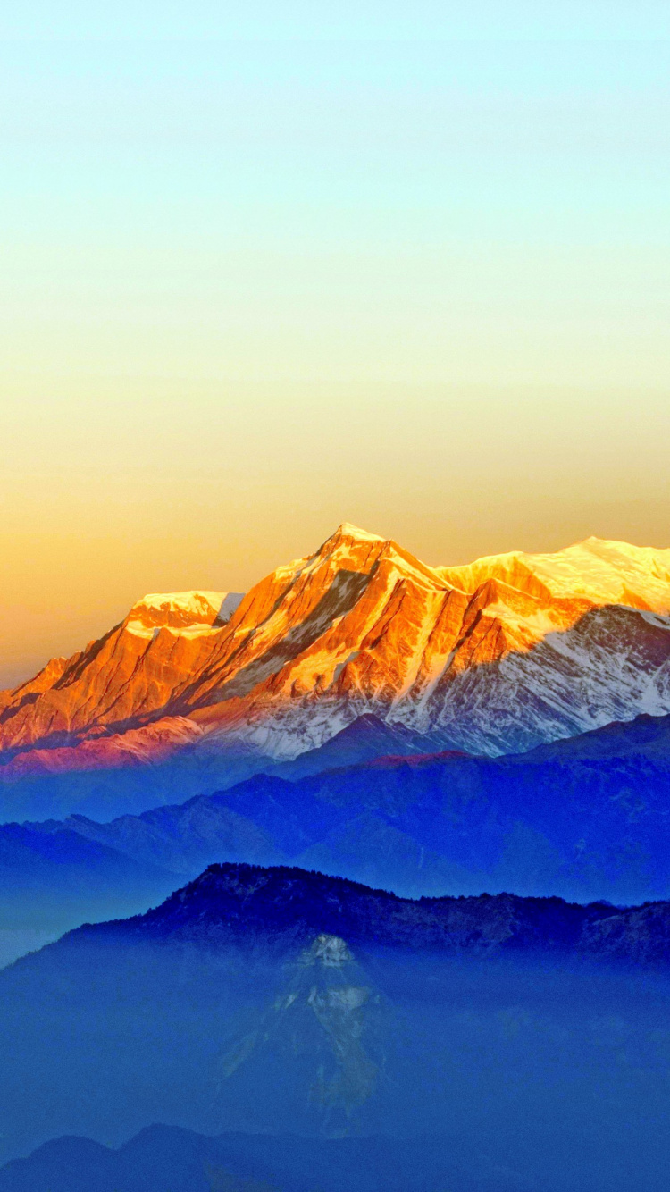 Brown Mountains Under Blue Sky During Daytime. Wallpaper in 750x1334 Resolution