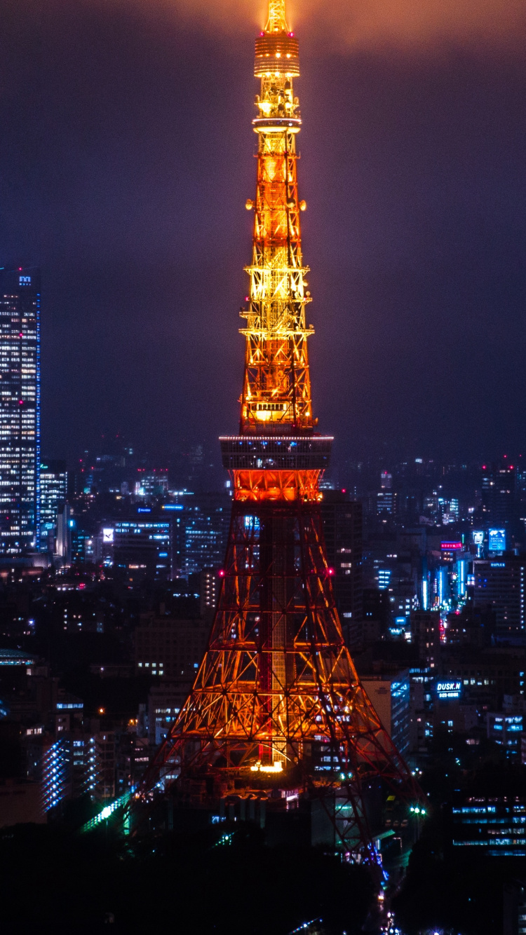 Eiffel Tower During Night Time. Wallpaper in 750x1334 Resolution