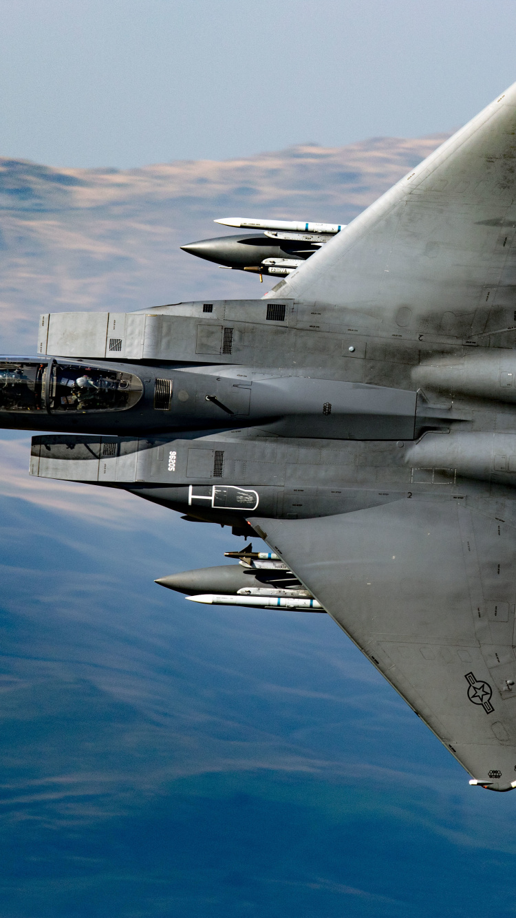 Gray Fighter Jet Flying Over Blue Sky During Daytime. Wallpaper in 750x1334 Resolution