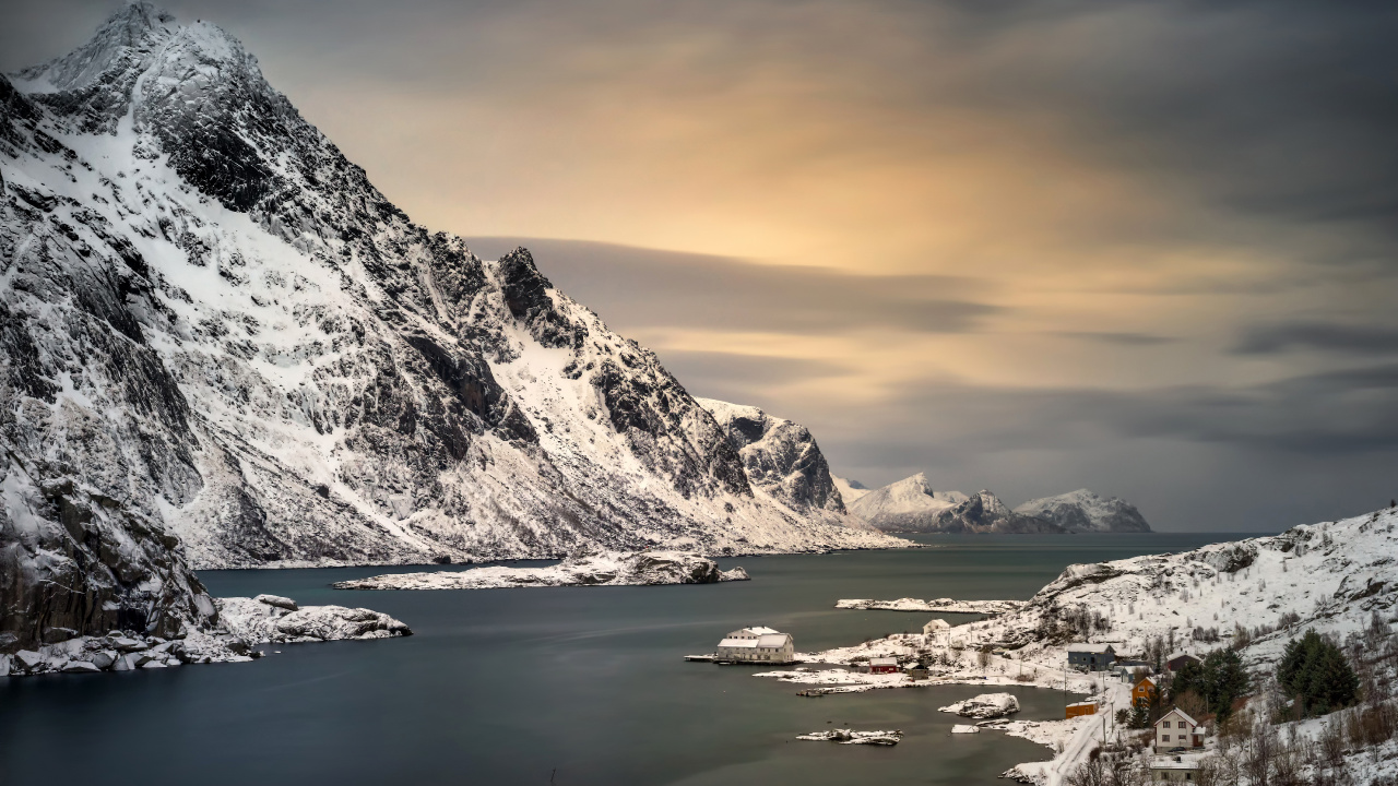 Snow Covered Mountain Near Body of Water During Daytime. Wallpaper in 1280x720 Resolution