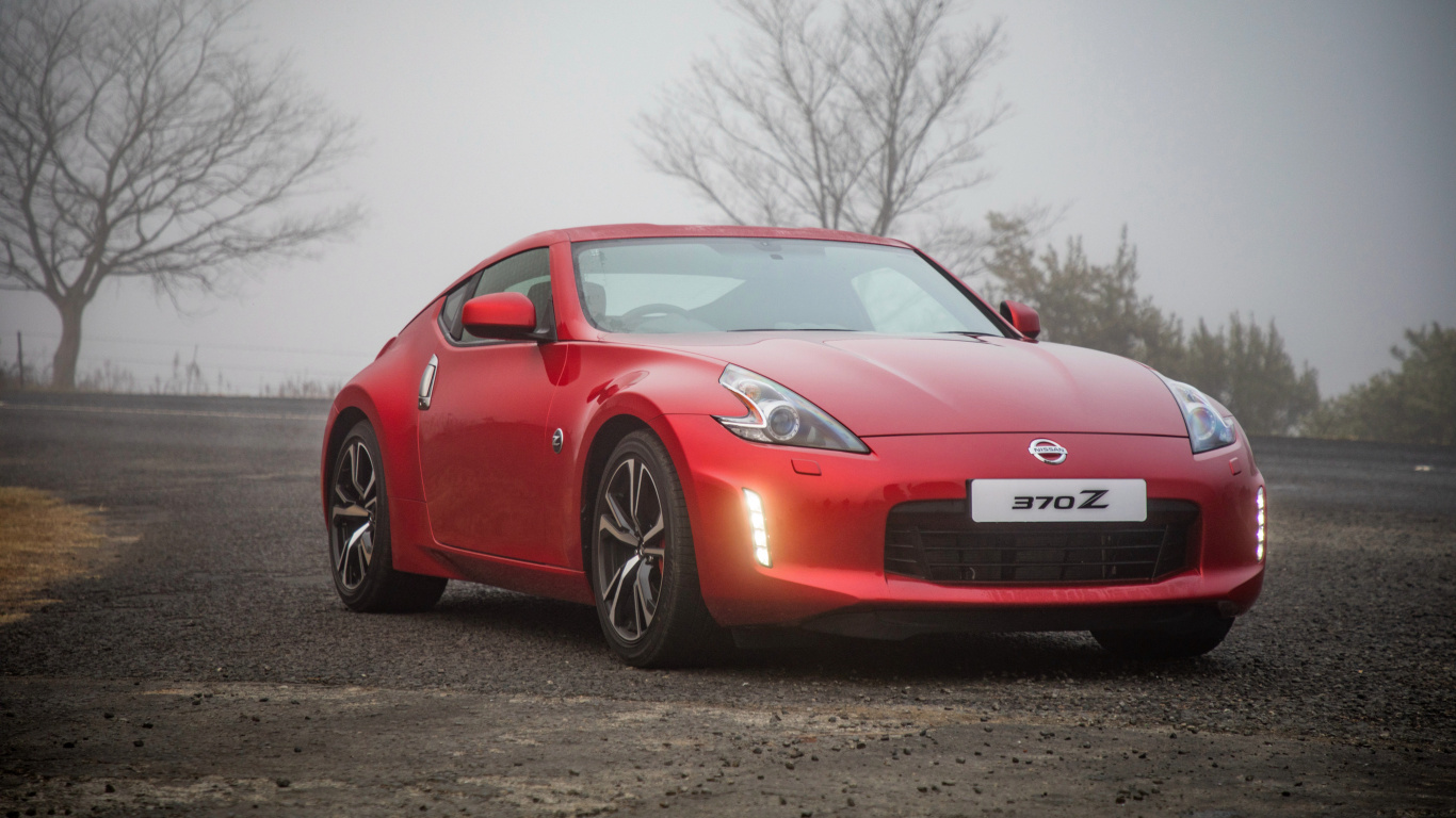 Red Porsche 911 Parked on Gray Asphalt Road During Daytime. Wallpaper in 1366x768 Resolution