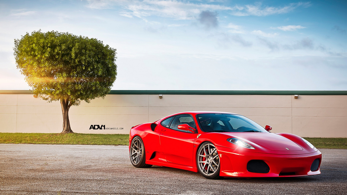 Red Coupe Parked Near Green Tree Under White Clouds and Blue Sky During Daytime. Wallpaper in 1366x768 Resolution