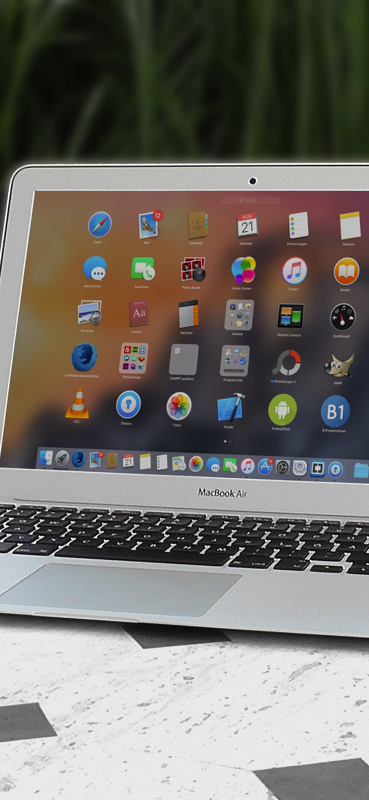 Macbook Air on White Table. Wallpaper in 1242x2688 Resolution