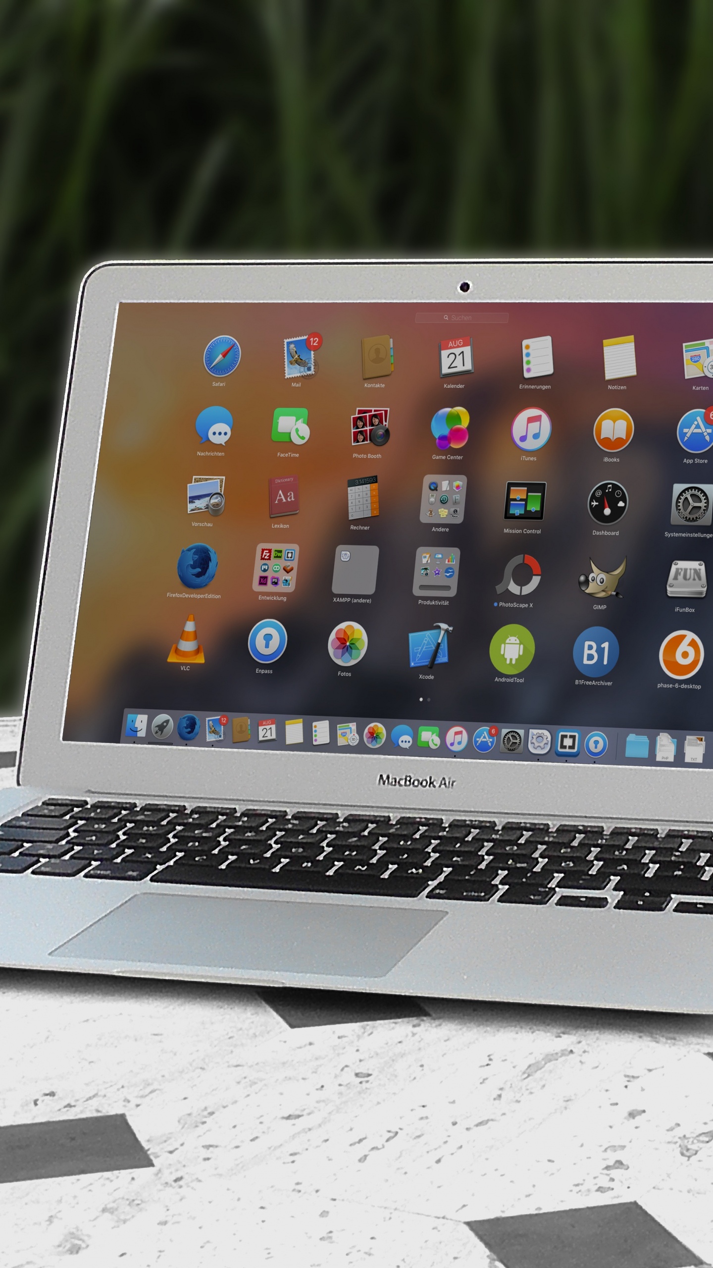 Macbook Air on White Table. Wallpaper in 1440x2560 Resolution