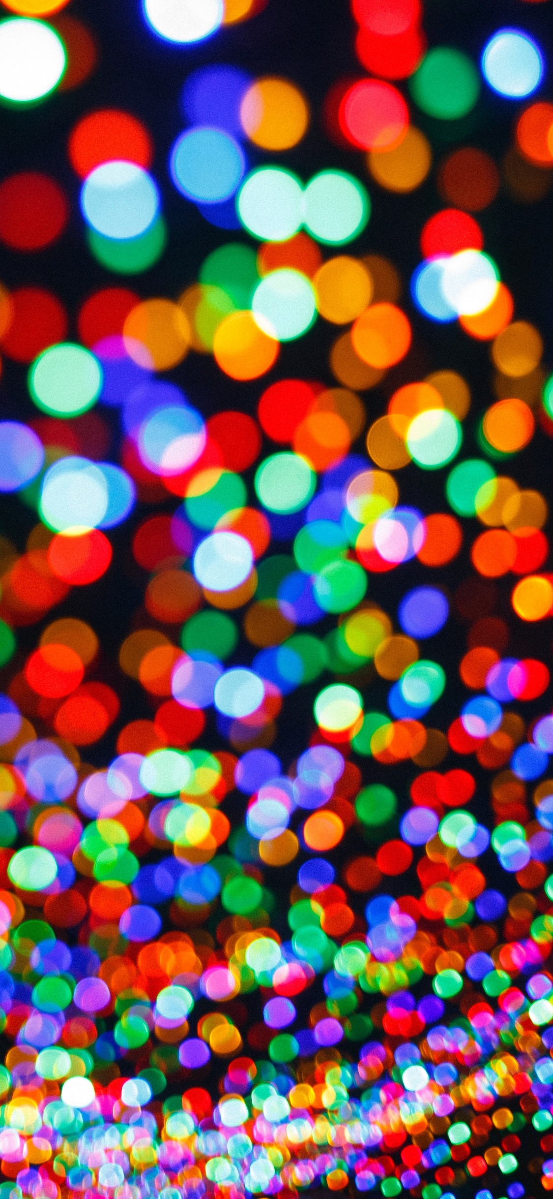 Blue Pink and Yellow Multi Color Lights. Wallpaper in 1125x2436 Resolution