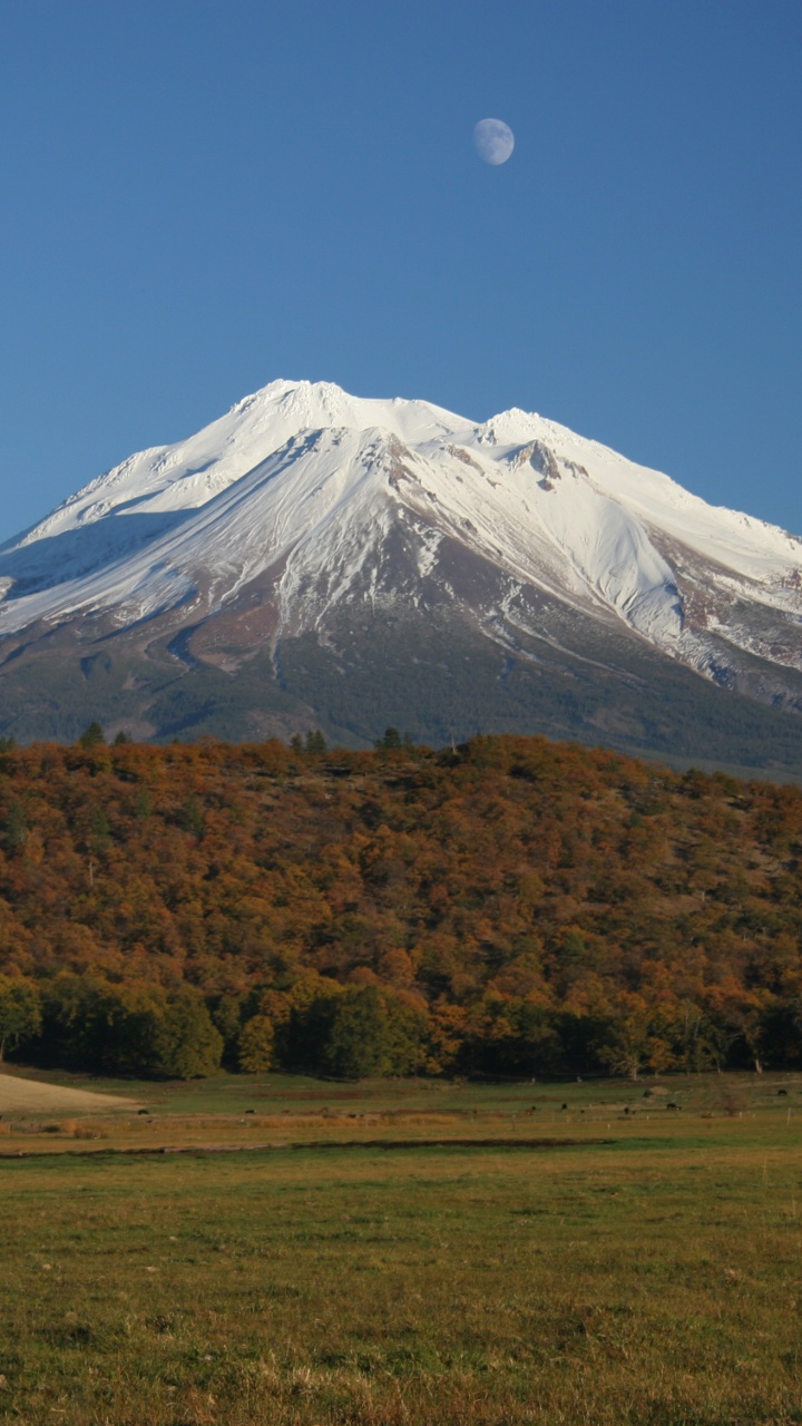 Schneebedeckter Berg Unter Blauem Himmel Tagsüber. Wallpaper in 720x1280 Resolution