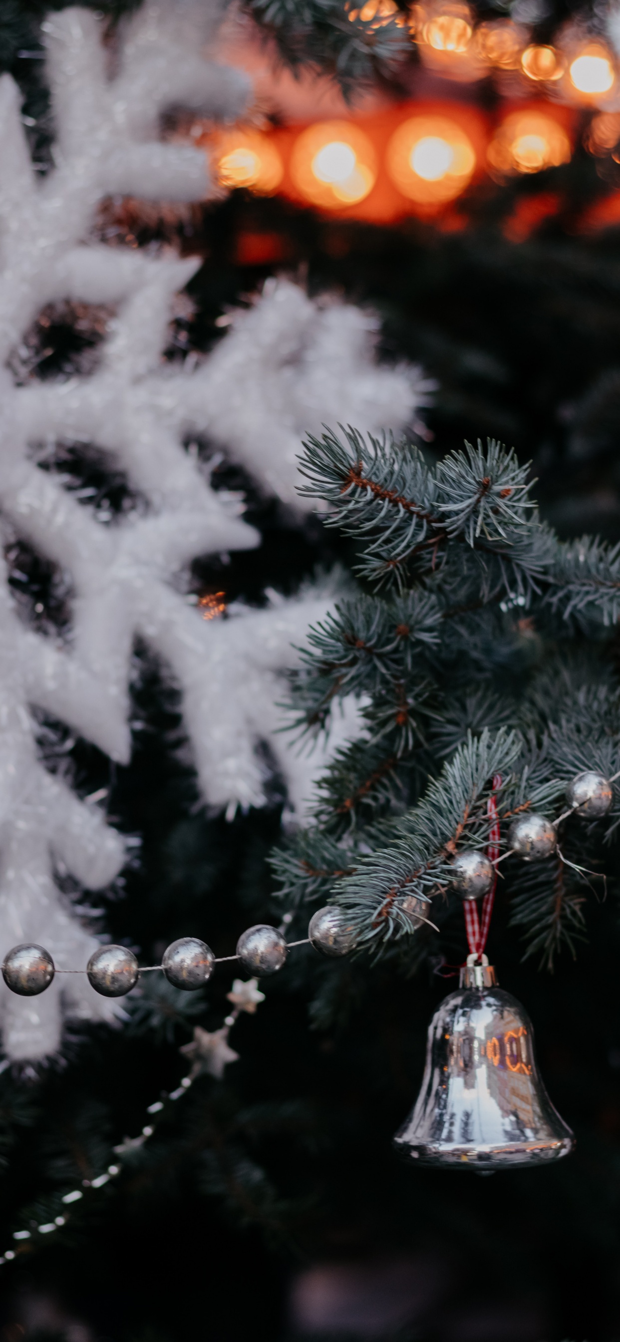 White Snow Flakes on Green Pine Tree. Wallpaper in 1242x2688 Resolution