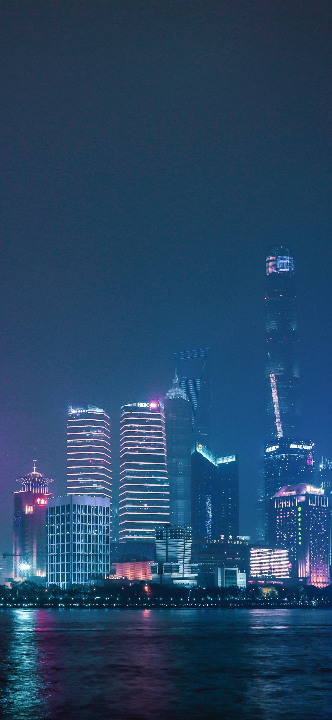 City Skyline During Night Time. Wallpaper in 1125x2436 Resolution