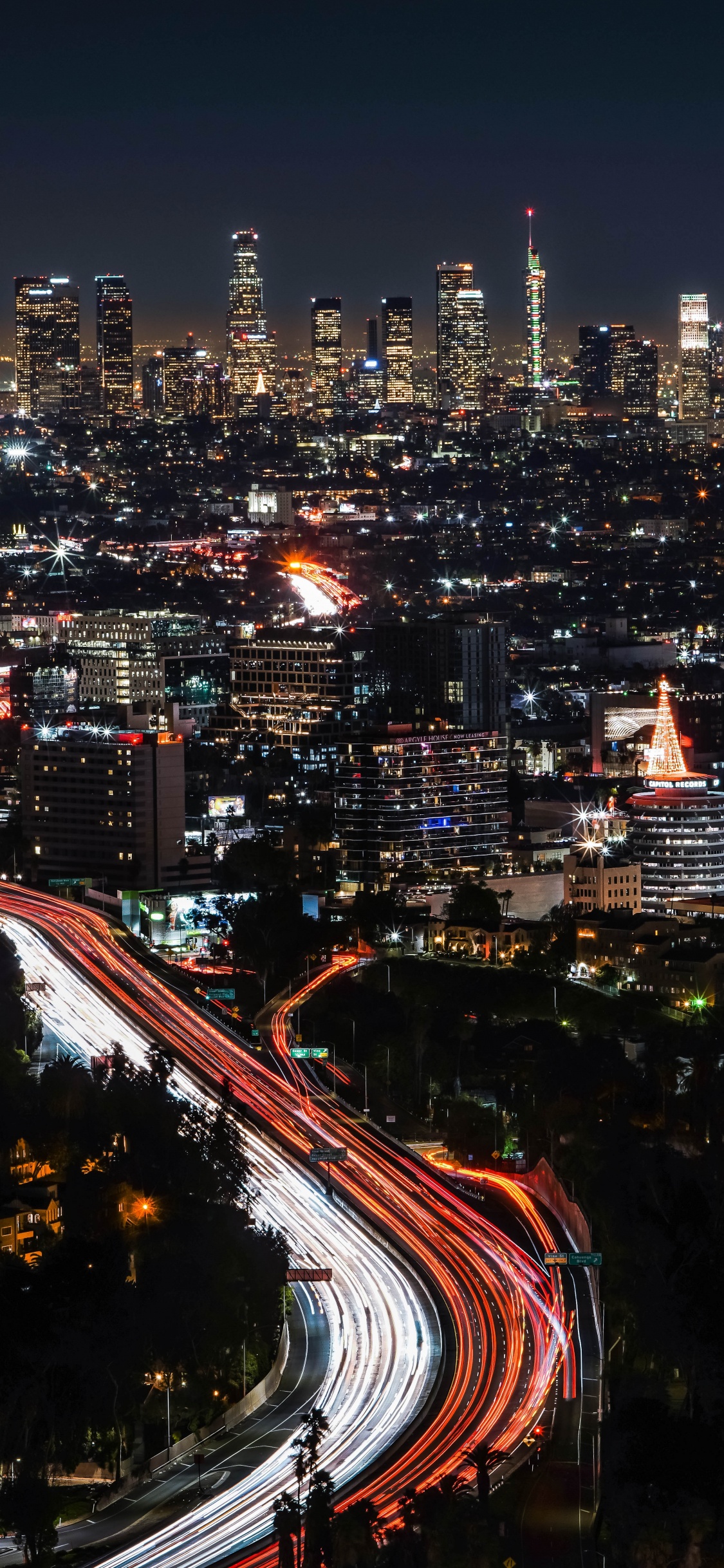 Time Lapse Photography of City Lights During Night Time. Wallpaper in 1125x2436 Resolution