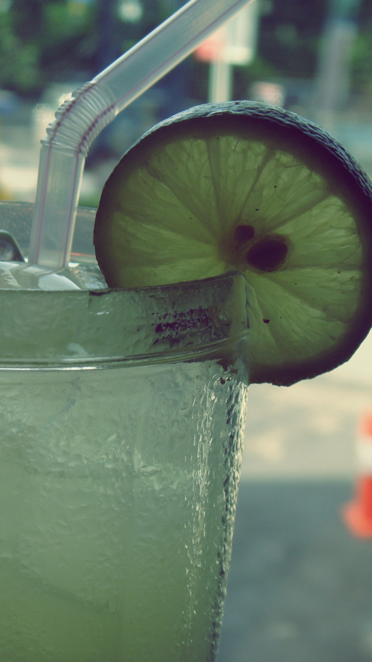 Clear Drinking Glass With Ice and Straw. Wallpaper in 750x1334 Resolution