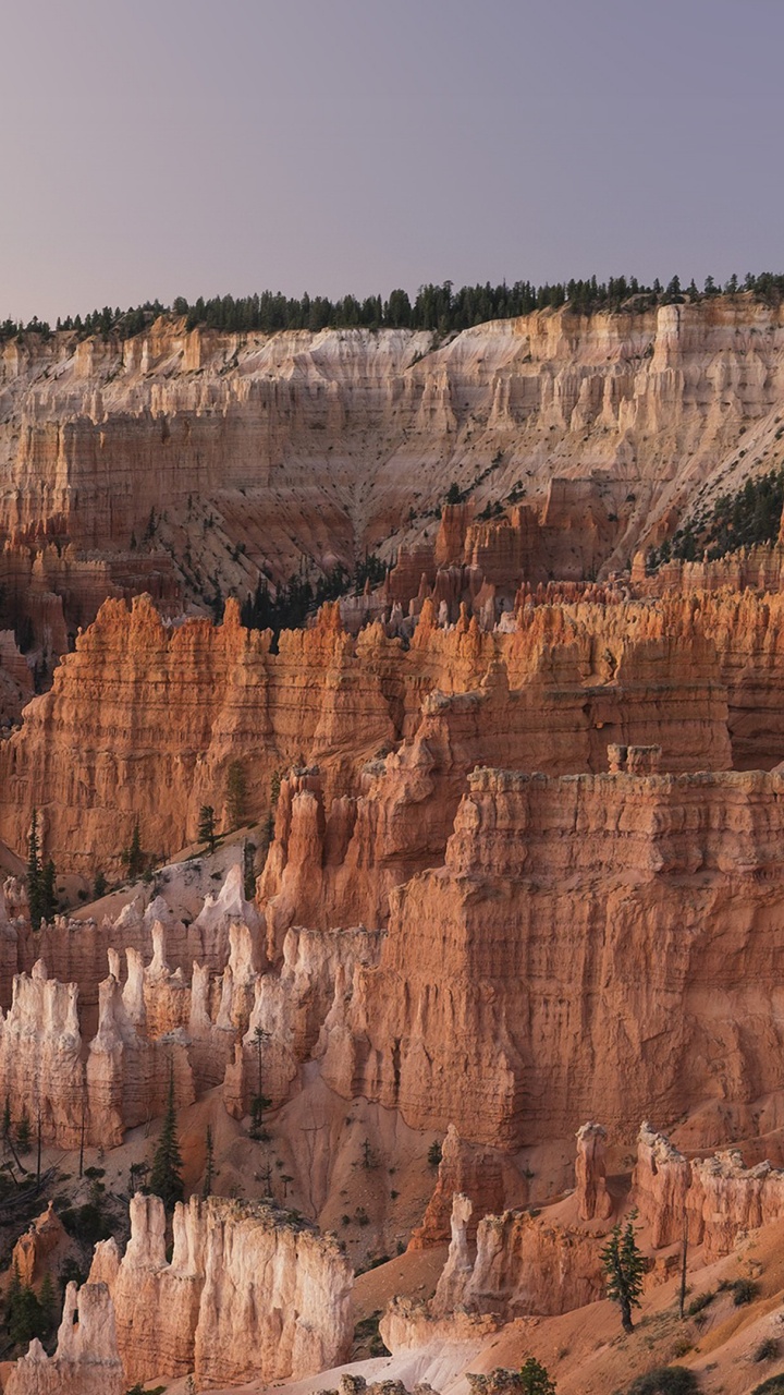 Brown Rocky Mountain Under Blue Sky During Daytime. Wallpaper in 720x1280 Resolution
