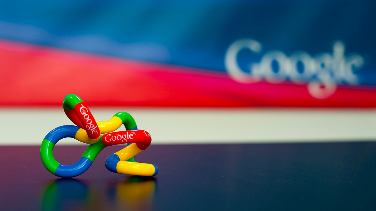 Red Blue and Yellow Heart Shaped Candies on Black Table. Wallpaper in 1280x720 Resolution