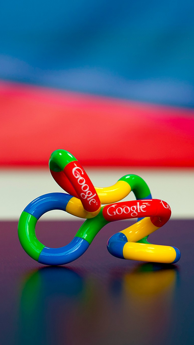 Red Blue and Yellow Heart Shaped Candies on Black Table. Wallpaper in 750x1334 Resolution