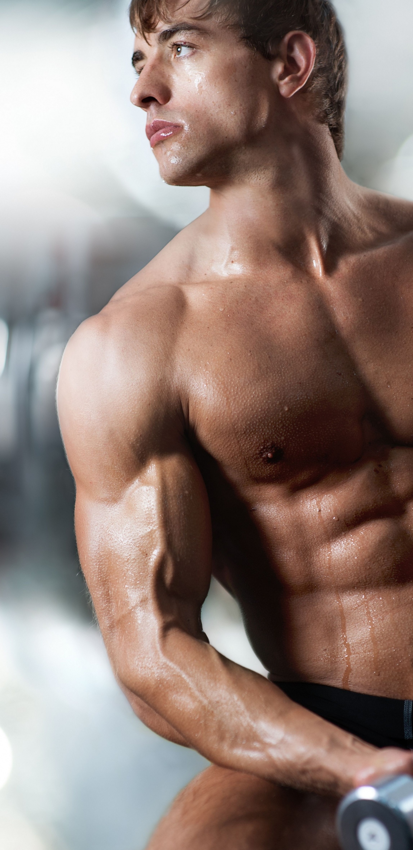 Topless Man in Black Shorts Holding Black Dumbbell. Wallpaper in 1440x2960 Resolution