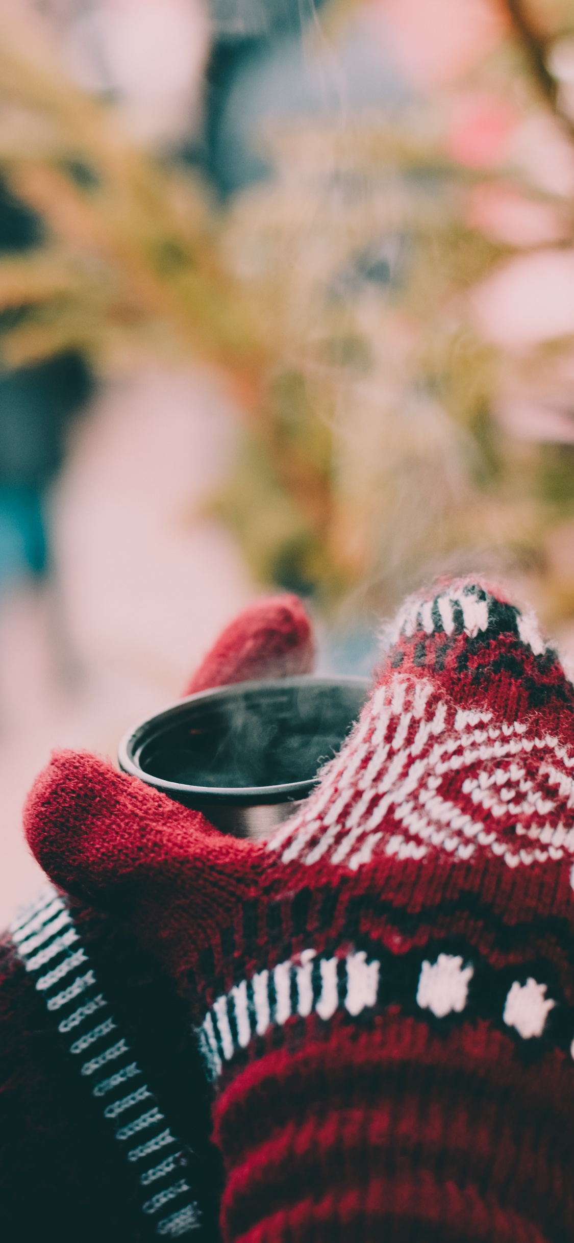 Person in Red White and Black Knit Sweater Holding Black Framed Eyeglasses. Wallpaper in 1125x2436 Resolution