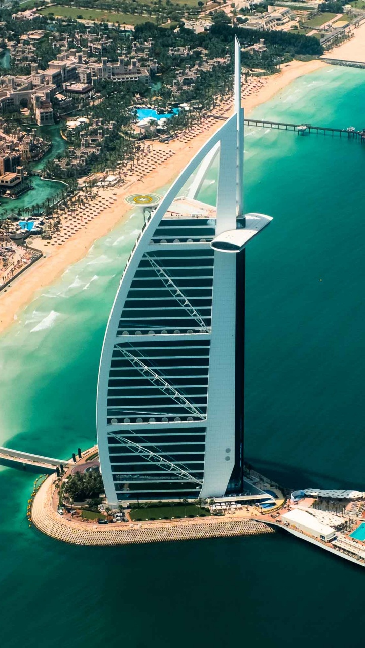 White and Green Bridge Over The Sea During Daytime. Wallpaper in 720x1280 Resolution