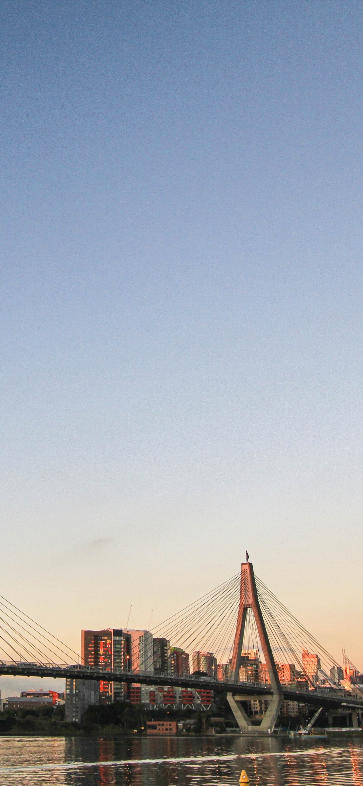 Bridge Over Body of Water During Daytime. Wallpaper in 1242x2688 Resolution