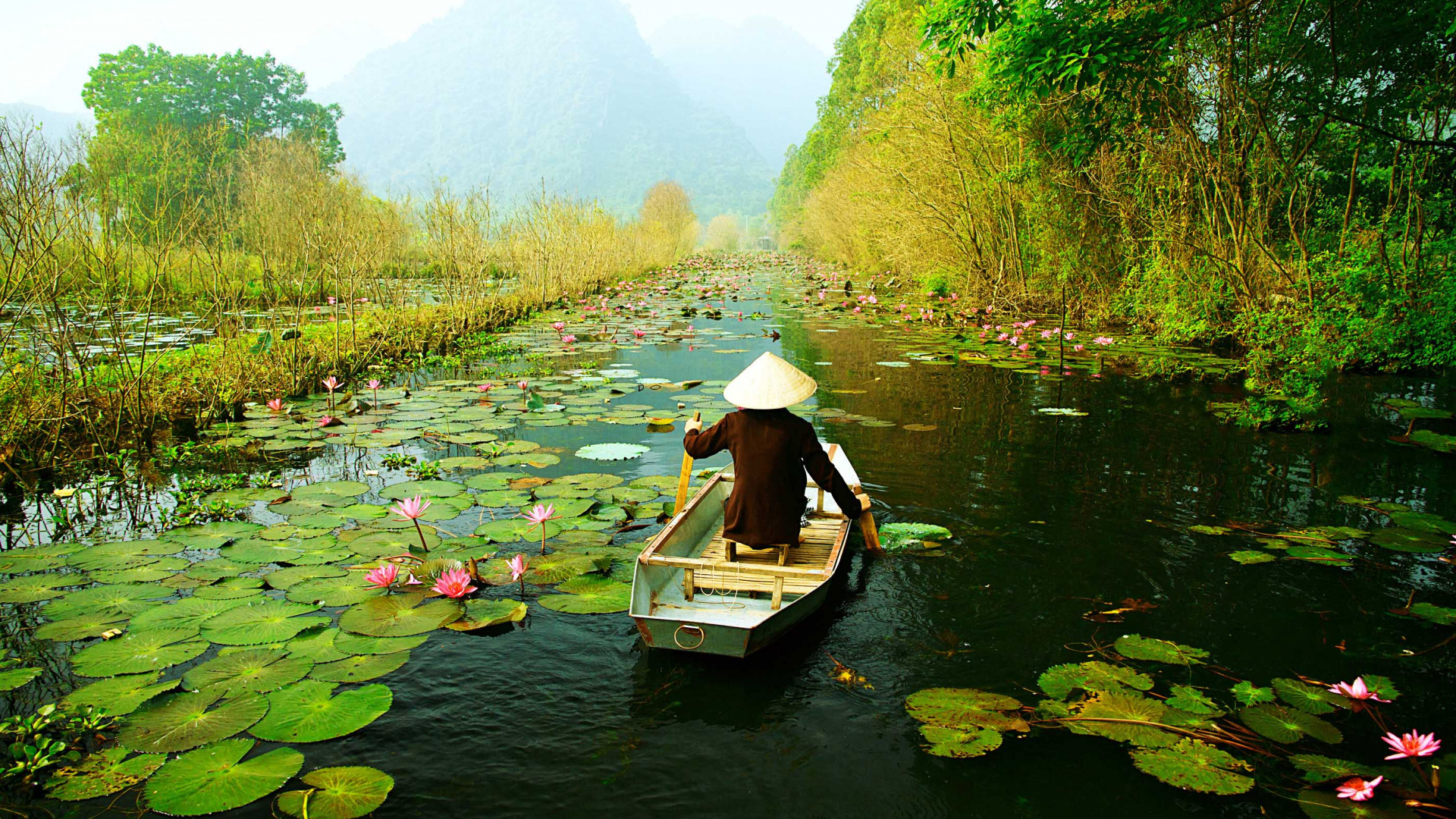 Woman in White Shirt Riding on Boat on River During Daytime. Wallpaper in 1920x1080 Resolution