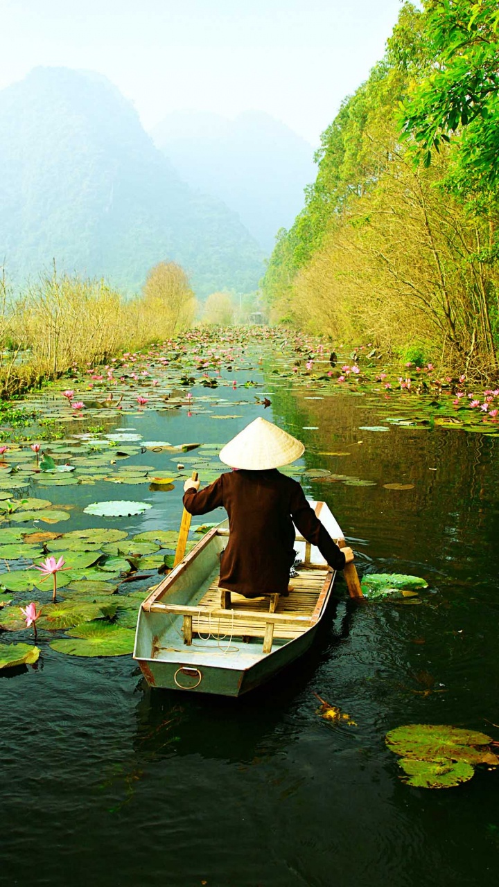 Woman in White Shirt Riding on Boat on River During Daytime. Wallpaper in 720x1280 Resolution