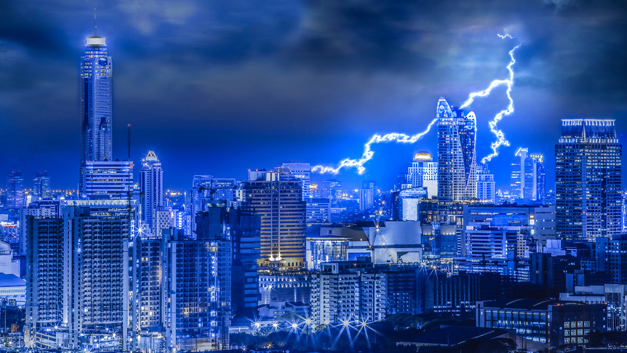 City Skyline Under Blue Sky and White Clouds During Night Time. Wallpaper in 1280x720 Resolution