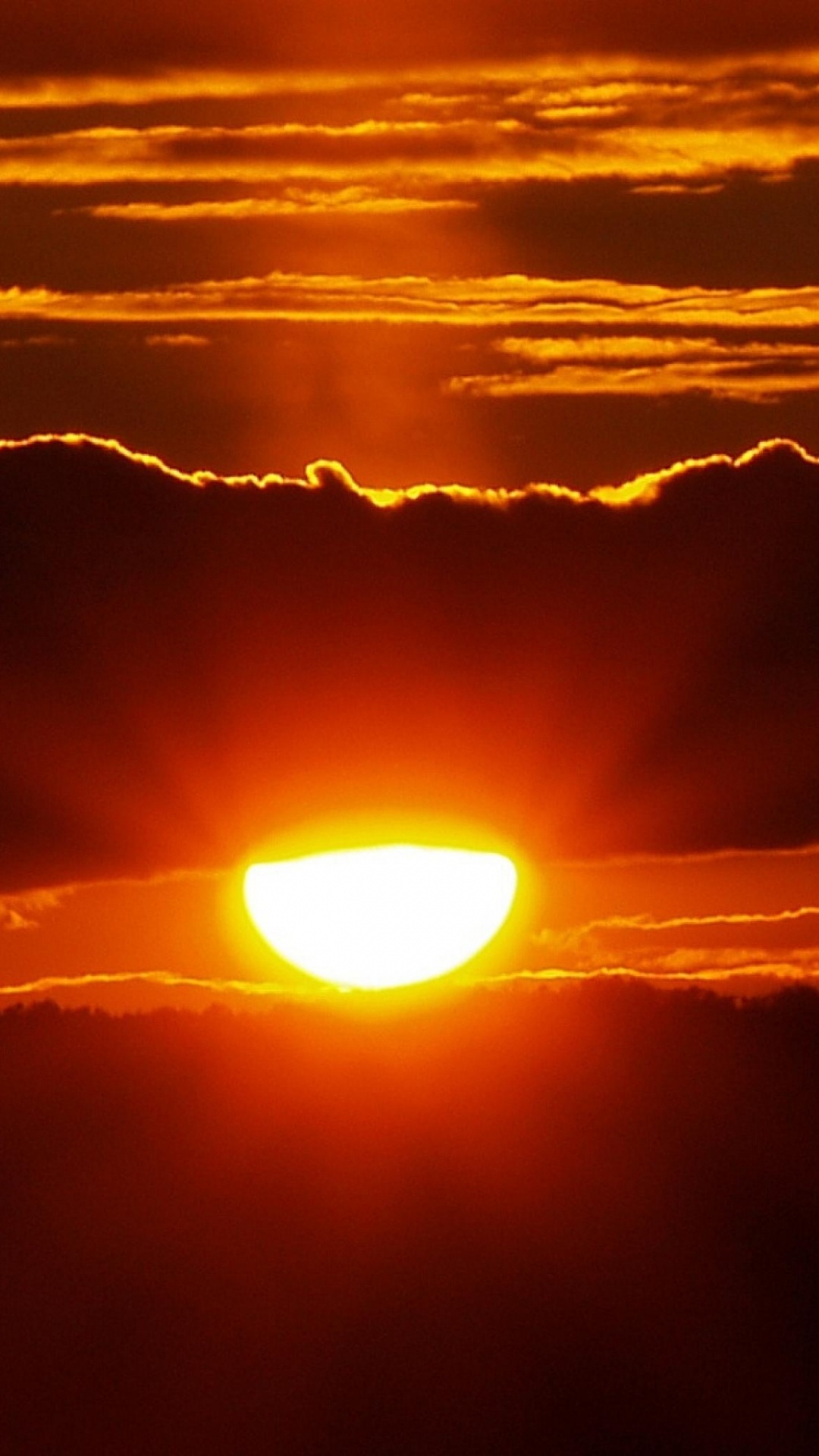 Sun Setting Over The Clouds. Wallpaper in 1080x1920 Resolution