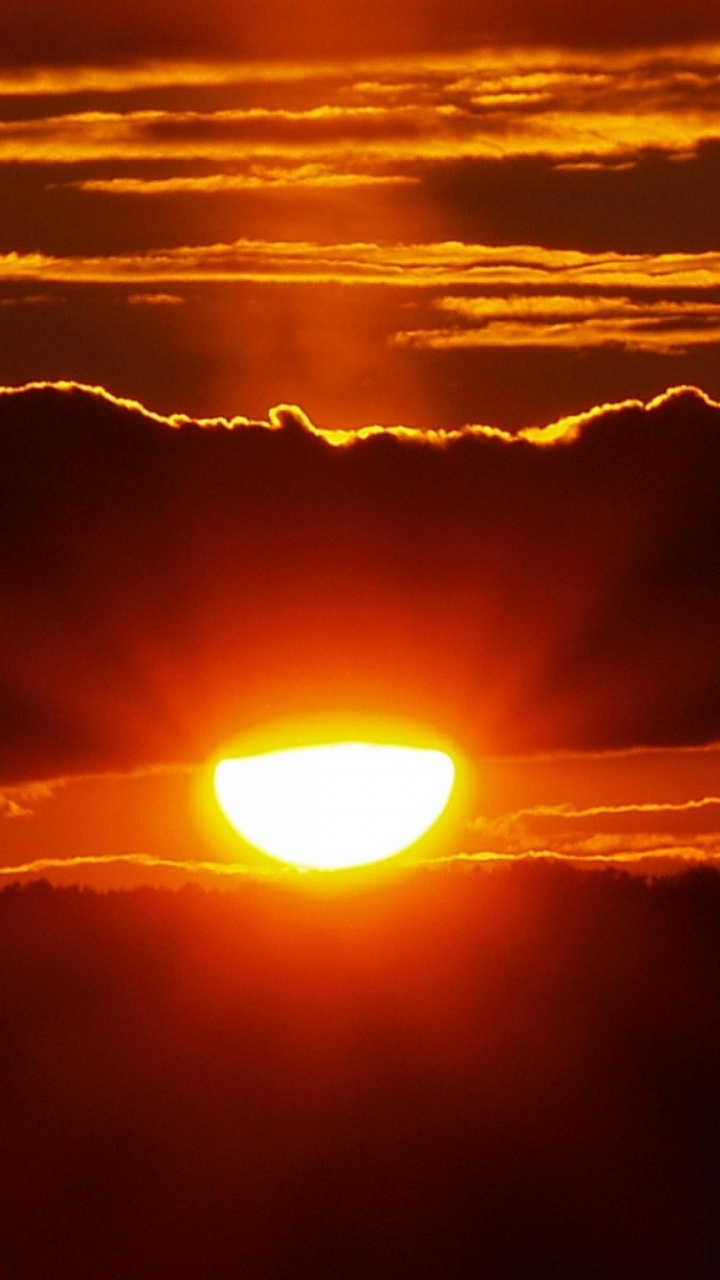 Puesta de Sol Sobre Las Nubes. Wallpaper in 720x1280 Resolution