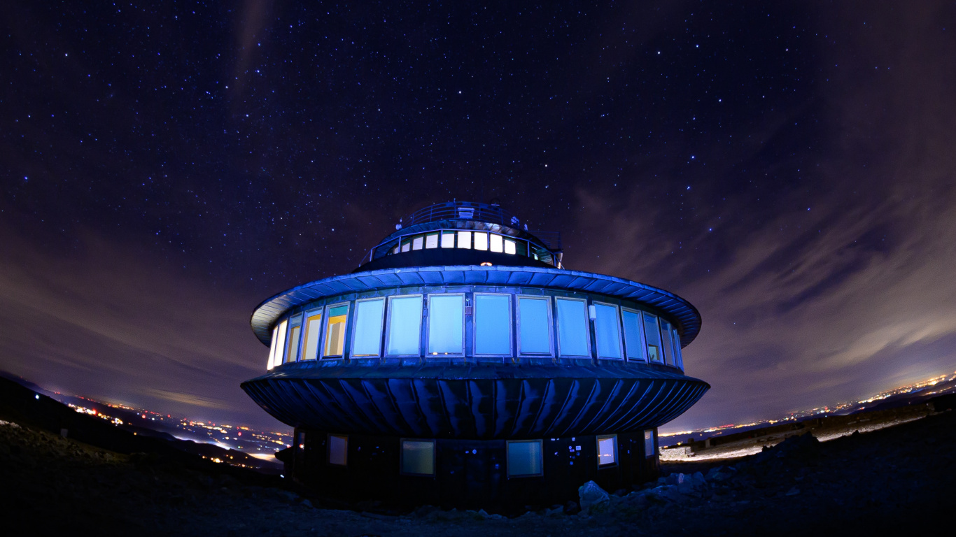 Blue and White Building Under Starry Night. Wallpaper in 1366x768 Resolution