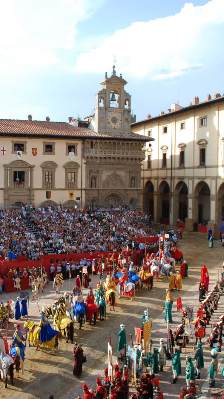 People Walking on Street Near Brown Concrete Building During Daytime. Wallpaper in 750x1334 Resolution