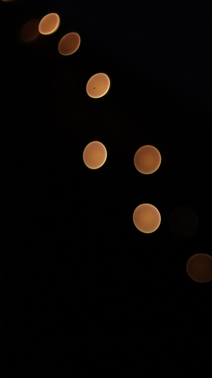 Luces Amarillas Sobre Fondo Negro. Wallpaper in 720x1280 Resolution