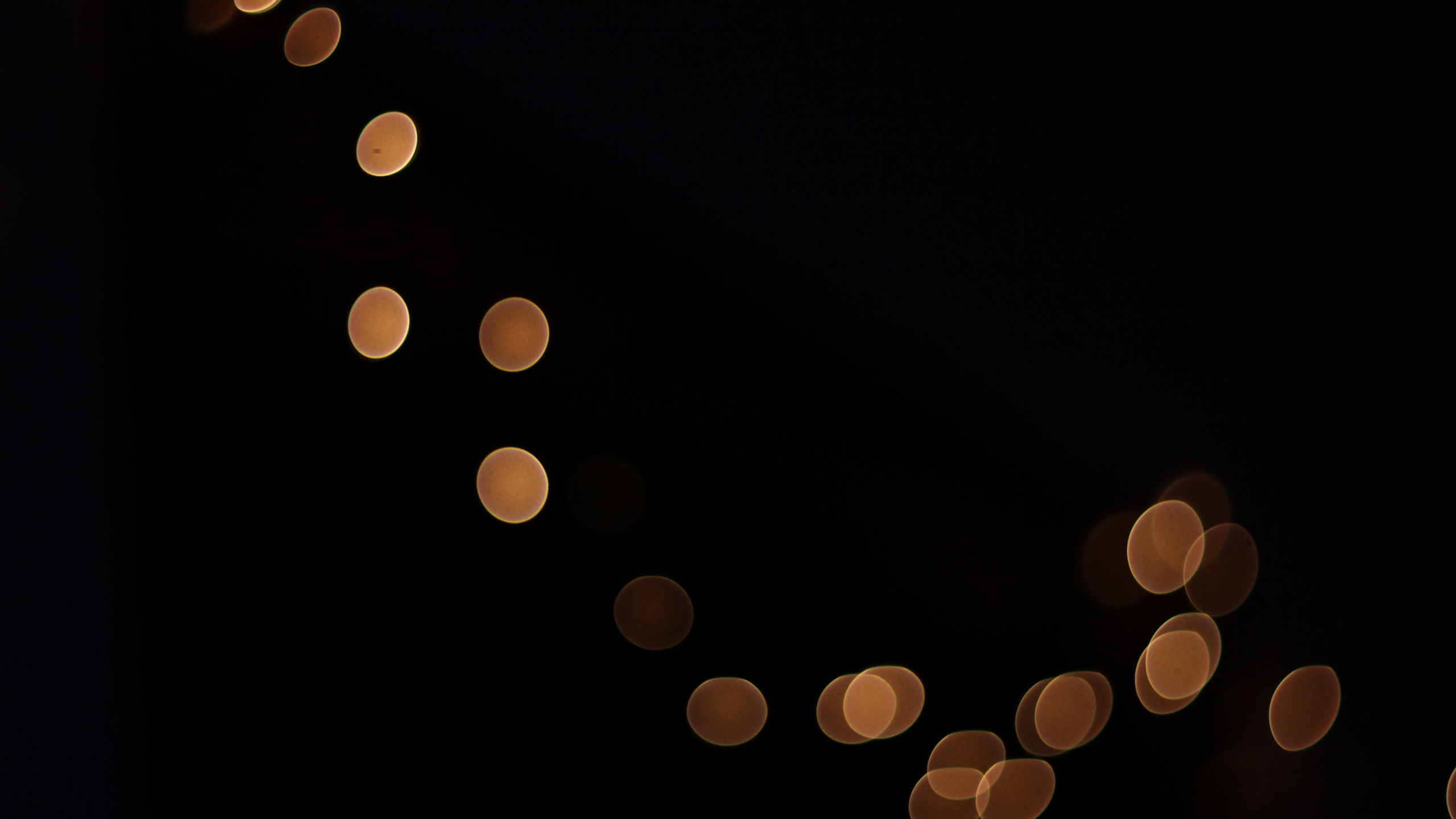 Yellow Lights on Black Background. Wallpaper in 2560x1440 Resolution